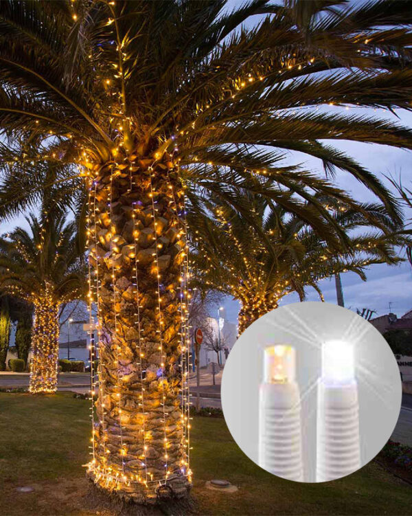 LED+ lysgardin med slowflash på en palme.